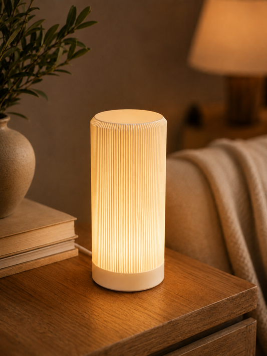 Ribbora Ribbed Table Lamp creating warm layered light on a side table