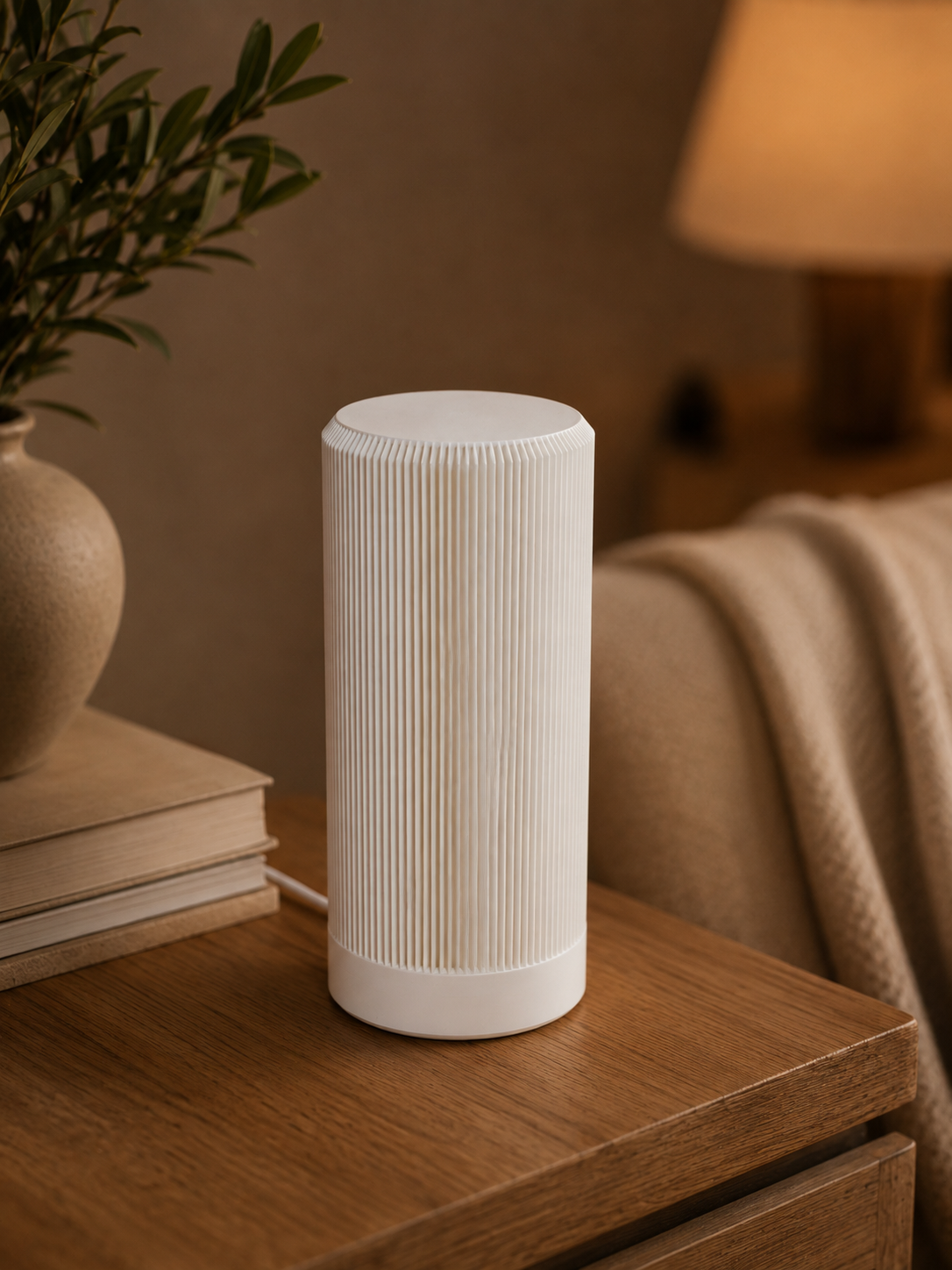 White Ribbora ribbed table lamp switched off on a wooden side table