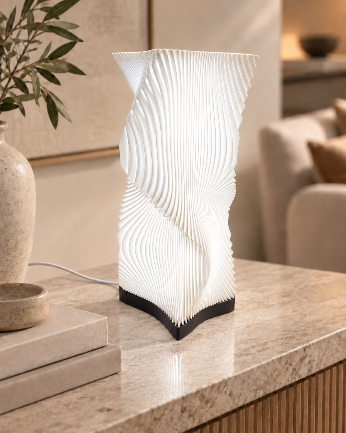 White Vela sculptural table lamp switched off with flowing parametric ribs