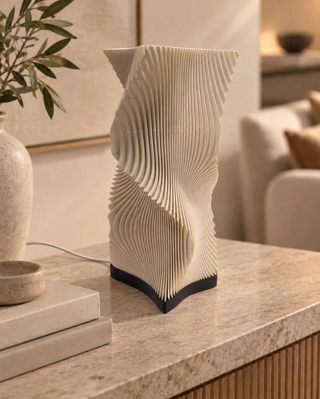Vela sculptural table lamp switched off in a warm neutral living space